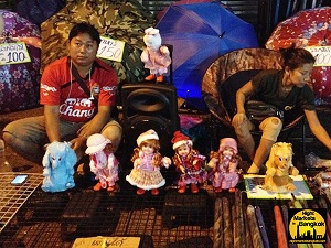 Selling some dolls at Khlong Thom Market